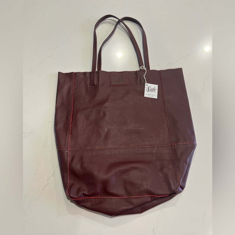 Sseko Safari Bucket Bag in oxblood/wine color